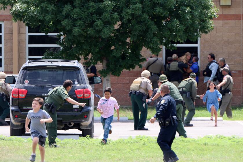 In a photo taken by Pete Luna, general manager of the Uvlade Leader-News terrified children are seen running from Robb Elementary during the school shooting on Tuesday, April 24, 2022. NO HANDOUT / NO SALES / MANDATORY CREDIT PETE LUNA / UVALDE LEADER-NEWS