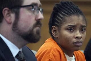 FILE - Chrystul Kizer,, listens as she sits with her attorney Gregory Holdahl during a hearing Thursday, May 9, 2024, at the Kenosha County Courthouse in Kenosha, Wis. (Sean Krajacic/The Kenosha News via AP, file)