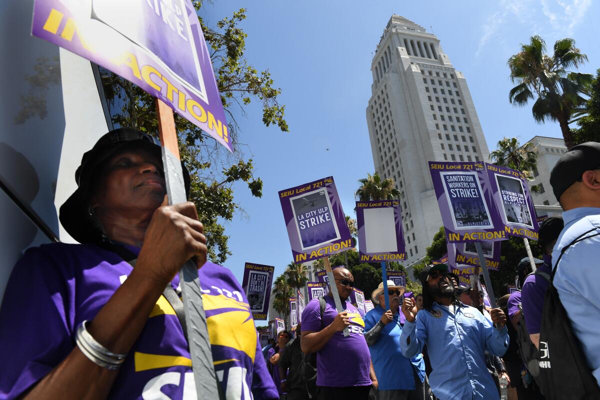 L.A. City workers strike outside City Hall in Los Angeles.