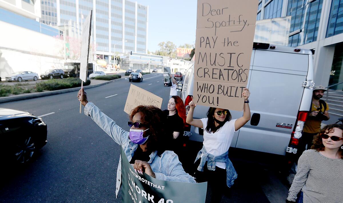 People holding placards and protesting.