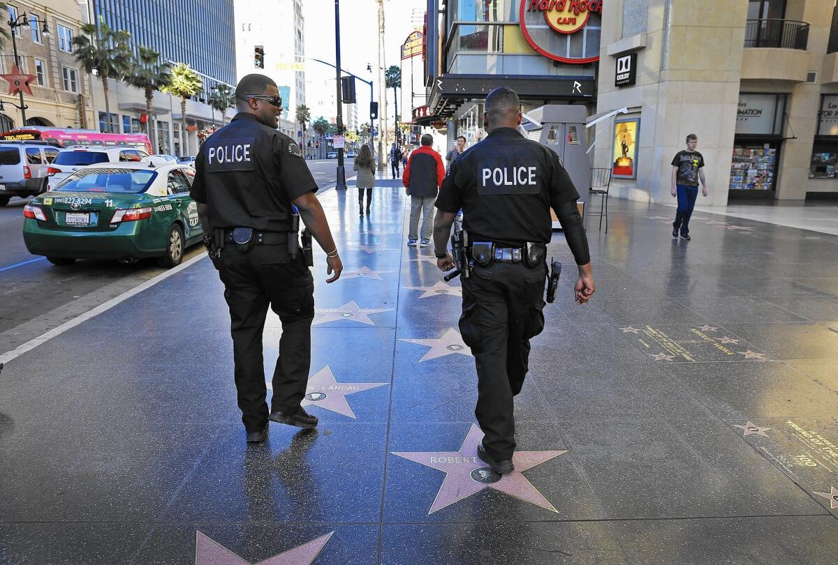 Violent crime in Hollywood has increased 21% this year through Oct. 10, compared with the same period last year. Above, LAPD officers in the district in January.