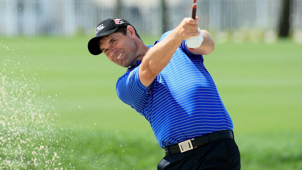 Padraig Harrington plays out of a bunker on the 18th hole during the final round of the Honda Classic in Palm Beach Gardens, Fla., on Monday.