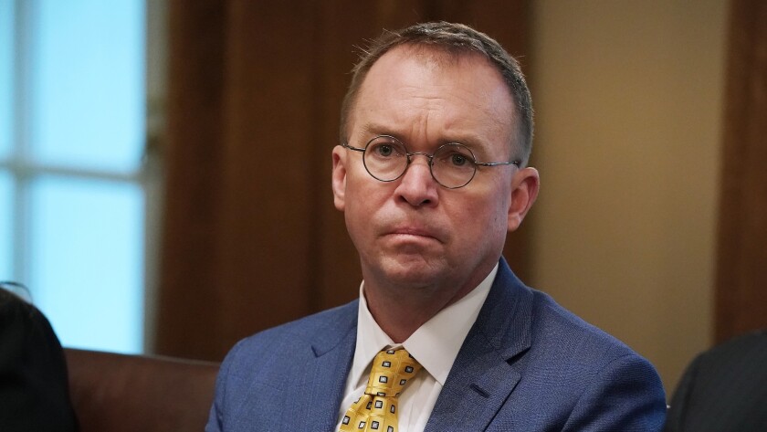 Acting White House Chief of Staff Mick Mulvaney, shown at an April 2 meeting in Washington, says Democrat are taking part in a “political hit job.”