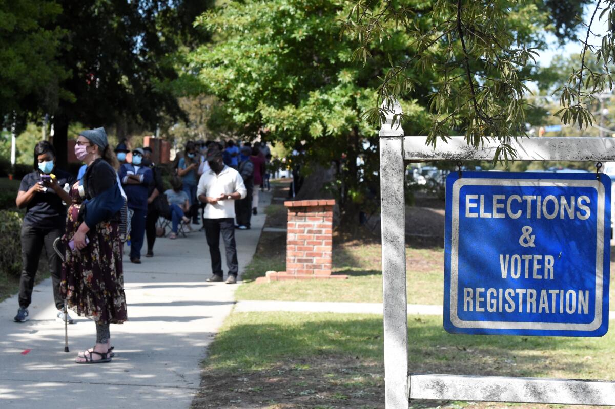 Voters wait in line outside the Richland County election office 