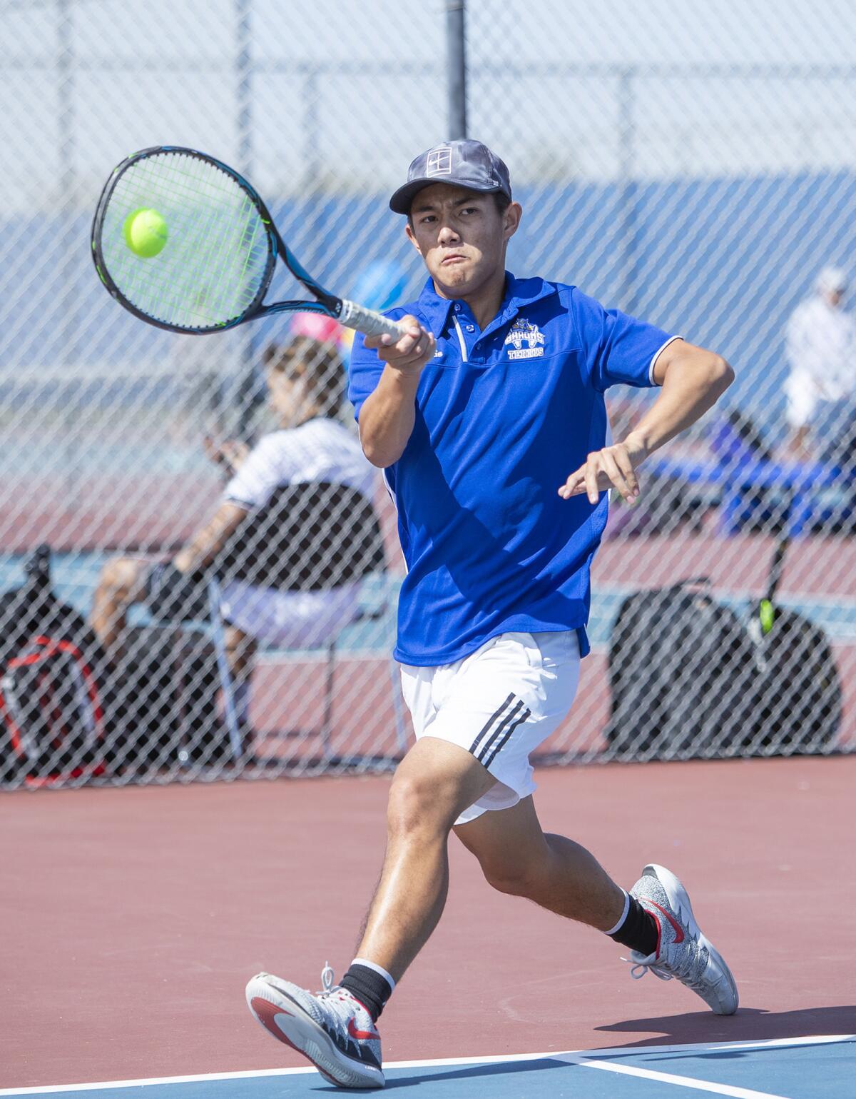 Fountain Valley High's Justin Nguyen returns a forehand during the first round of the CIF Southern Section Division 1 playoffs against Beverly Hills at home on Wednesday.