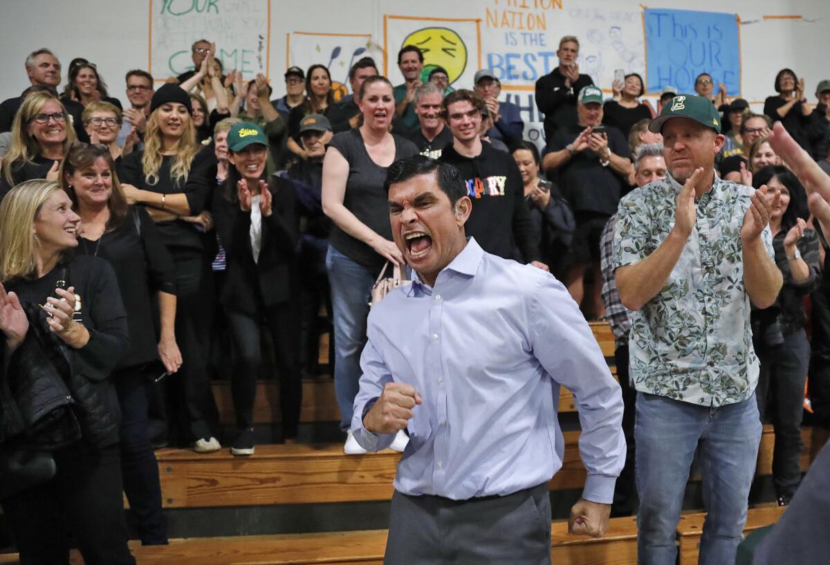 Edison head coach Rich Boyce runs into the crowd after Friday night's come-from-behind win at Pacifica Christian. 