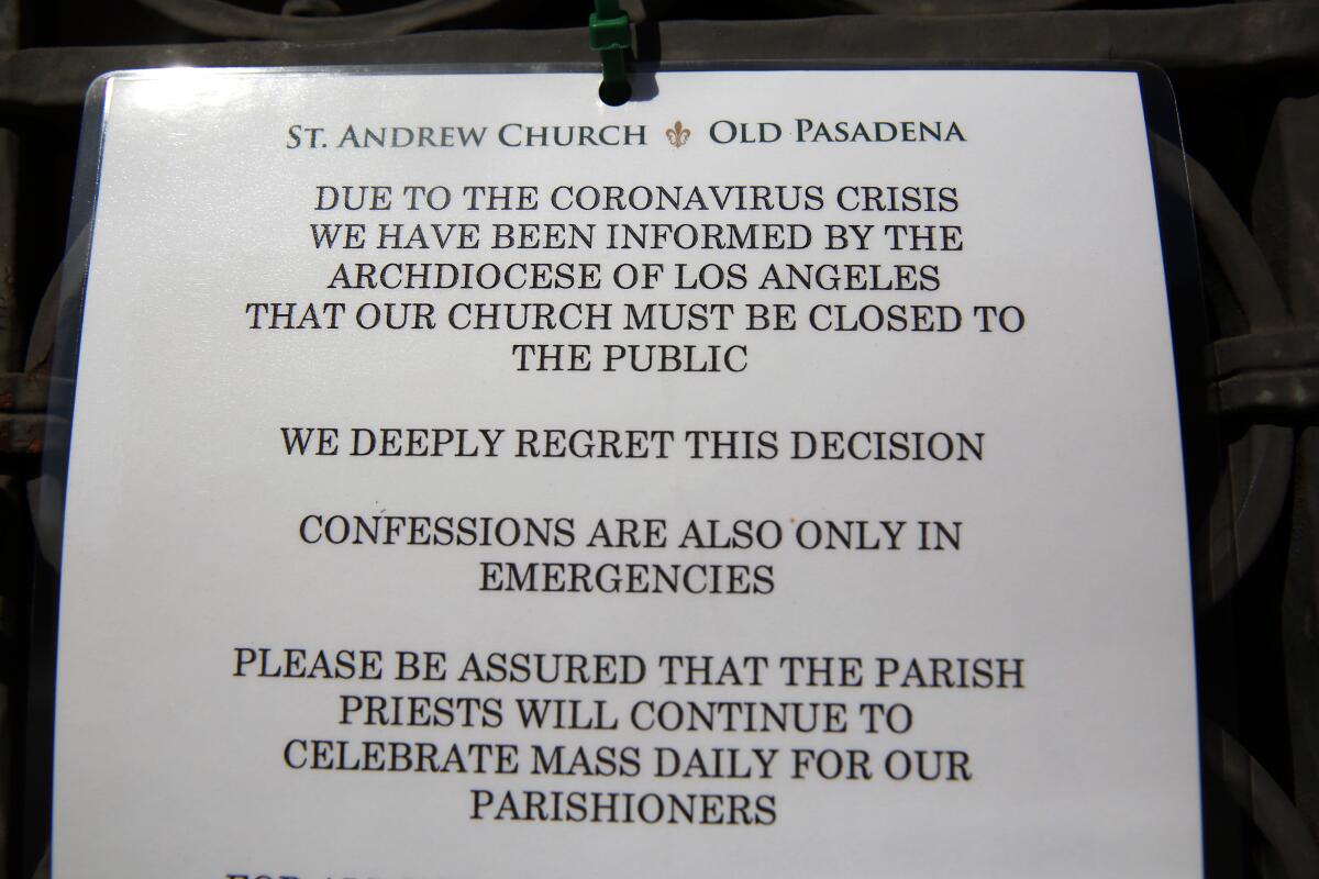 A sign outside St. Andrew Church. Over a dozen parish and school employees were furloughed.