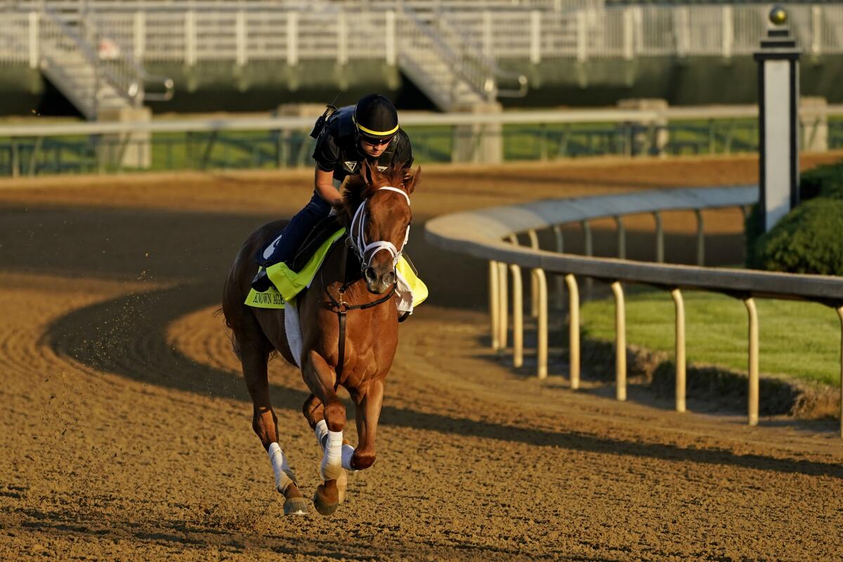 Kentucky Derby hopeful Known Agenda works out at Churchill Downs Tuesday, April 27, 2021, in Louisville, Ky. The 147th running of the Kentucky Derby is scheduled for Saturday, May 1. (AP Photo/Charlie Riedel)