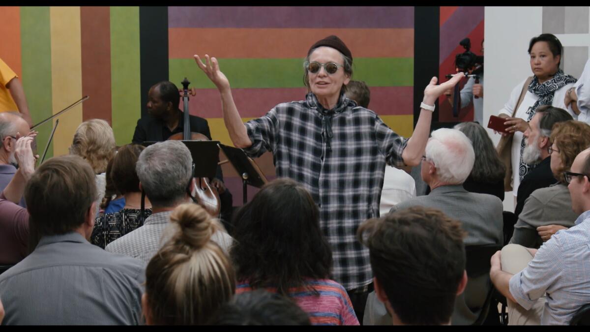Performer and artist Laurie Anderson greets a crowd at MASS MoCA. 