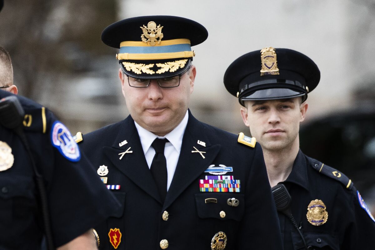 Army Lt. Col. Alexander S. Vindman, who is assigned to the National Security Council, arrives Tuesday to testify in the impeachment inquiry.