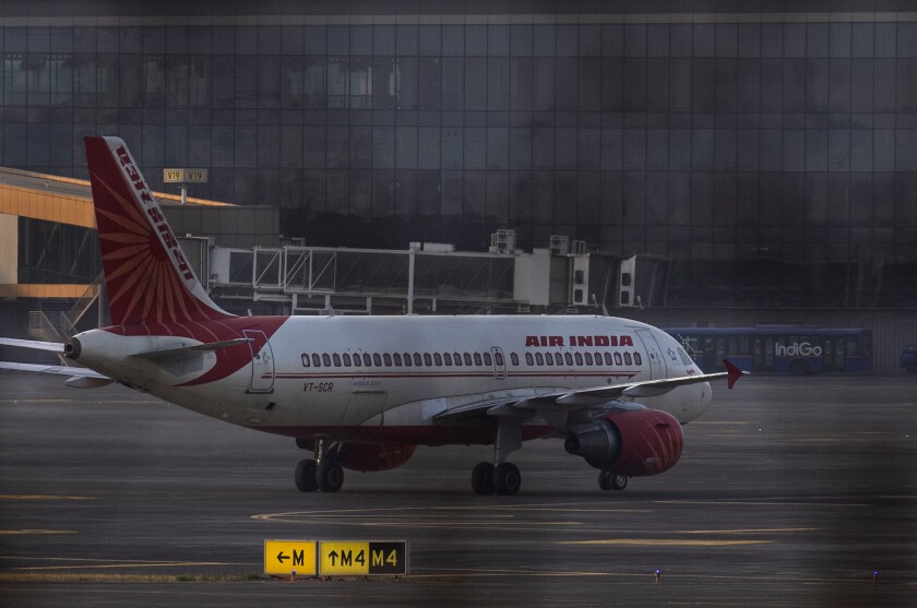 An Air India plane is ready to take off from Chhatrapati Shivaji Maharaj International Airport in Mumbai, India, Thursday, Jan. 27, 2022. Tata Sons, India's oldest and largest conglomerate, on Thursday regained the ownership of the country's debt-laden national carrier Air India that it launched decades ago but was taken over by the government. Tata Sons Chairman N. Chandrasekaran met with Prime Minister Narendra Modi ahead of his meeting with Air India officials to put his company's nominees on a new board. (AP Photo/Rafiq Maqbool)