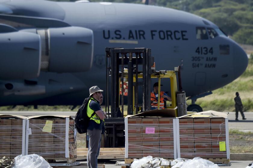 Food and medicine aid for Venezuela is unloaded Feb. 16 from a U.S. Air Force C-17 aircraft at Camilo Daza International Airport in Cucuta, Colombia, near the border with Venezuela.
