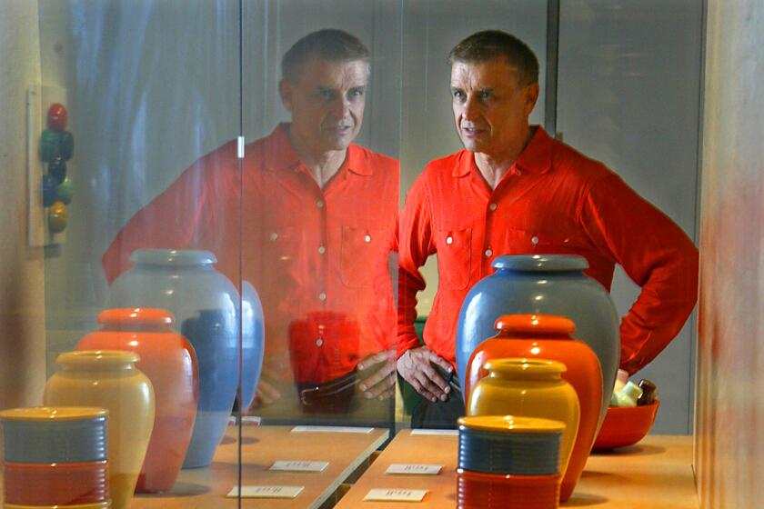 Ken Hively   Story about California pottery. There is a new show at the Autry Museum about California pottery that was curated by BILL STERN. August 6, 2003. Photo of Bill Stern curator of California Pottery exhibit at Autry Museum with J.A.Bauer Pottery Co. (LOS ANGELES TIMES PHOTO BY KEN HIVELY)
