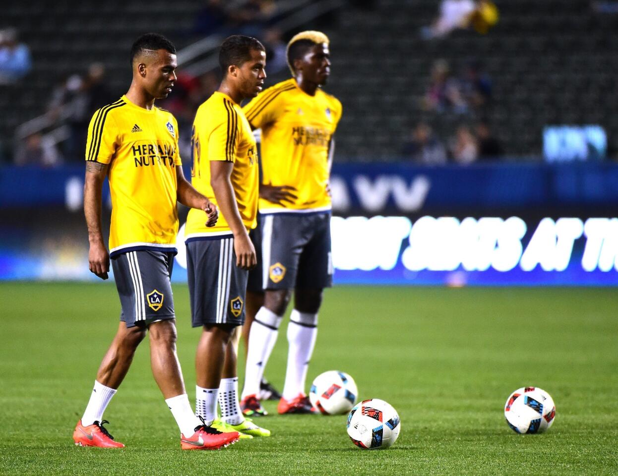 CARSON, CA - FEBRUARY 09: Ashley Cole #3 of the Los Angeles Galaxy warms up with Giovani Dos Santos #10 and Gyasi Zardes #11 before the match against Club Tijuana at StubHub Center on February 9, 2016 in Carson, California. (Photo by Harry How/Getty Images) ** OUTS - ELSENT, FPG, CM - OUTS * NM, PH, VA if sourced by CT, LA or MoD **