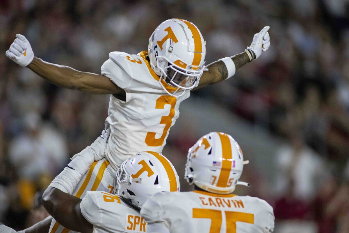 Tennessee wide receiver JaVonta Payton (3) celebrates with teammates after his touchdown reception during the first half of the team's NCAA college football game against Alabama, Saturday, Oct. 23, 2021, in Tuscaloosa, Ala. (AP Photo/Vasha Hunt)