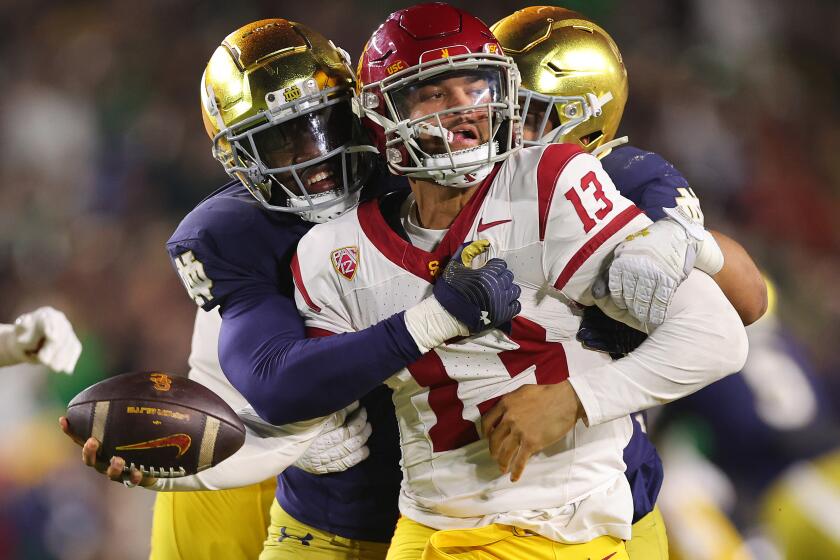 SOUTH BEND, INDIANA - OCTOBER 14: Caleb Williams #13 of the USC Trojans is sacked.
