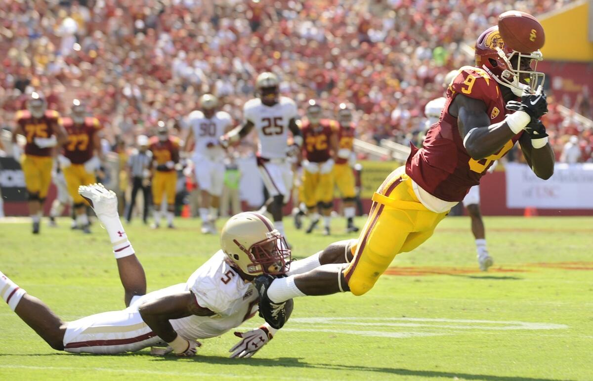 USC wide receiver Marqise Lee, right, can't haul in a pass while under pressure from Boston College's Al Louis-Jean Jr. during the Trojans' win on Saturday.
