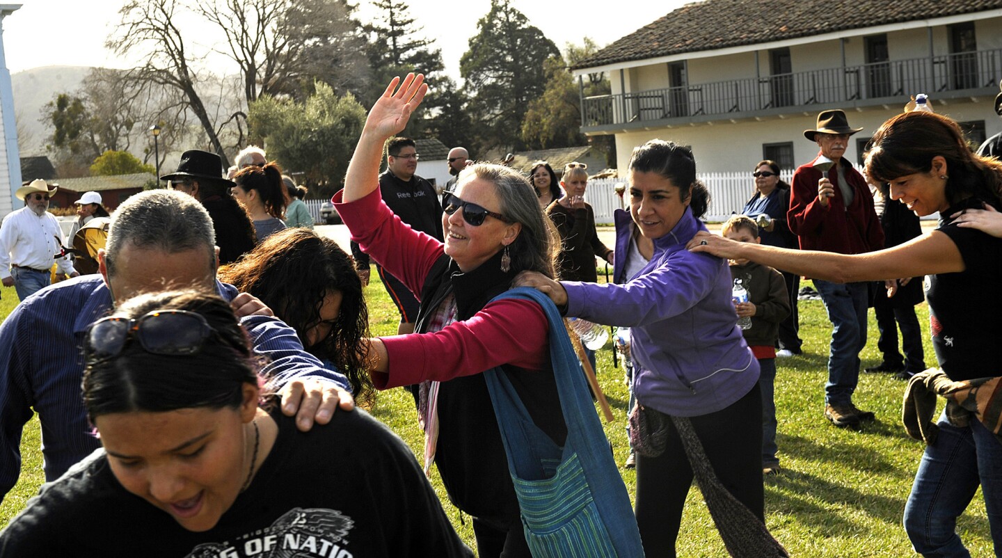 Participants dance in a circle during a rain dance in San Juan Bautista on a recent Sunday. The group meets every Sunday until the worst of the California drought ends.
