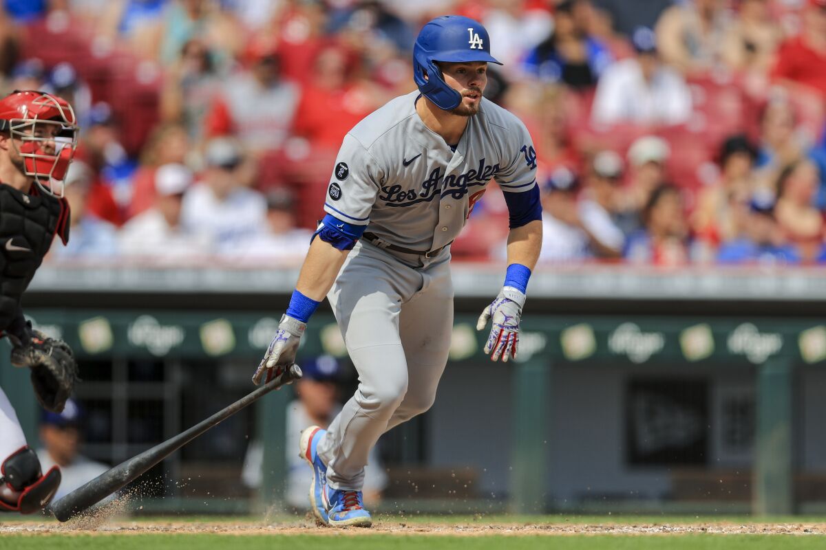 Dodgers outfielder Gavin Lux hits a two-run triple against the Cincinnati Reds on Sept. 18.