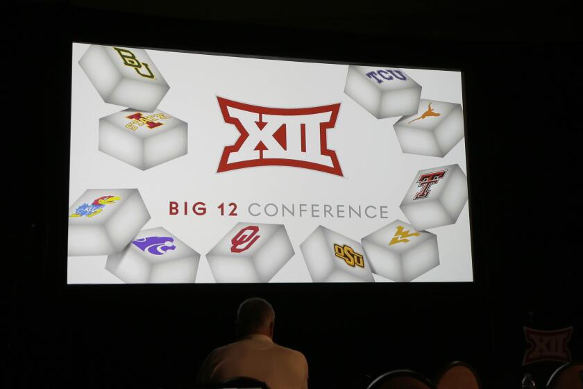 The Big 12 logo is shown during the Big 12 college football media days in Dallas, Tuesday, July 19, 2016. (AP Photo/LM Otero)