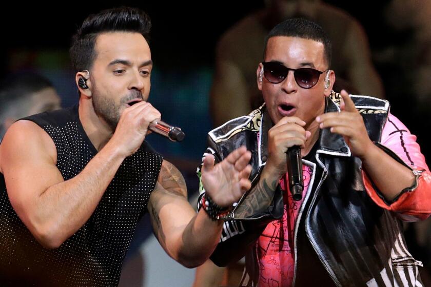 FILE - In this April 27, 2017 file photo, singers Luis Fonsi, left and Daddy Yankee perform during the Latin Billboard Awards in Coral Gables, Fla. On Friday, Aug. 4, 2017, YouTube announced that the music video for the No. 1 hit song âDespacitoâ has become the most viewed clip on YouTube of all-time. (AP Photo/Lynne Sladky, File)