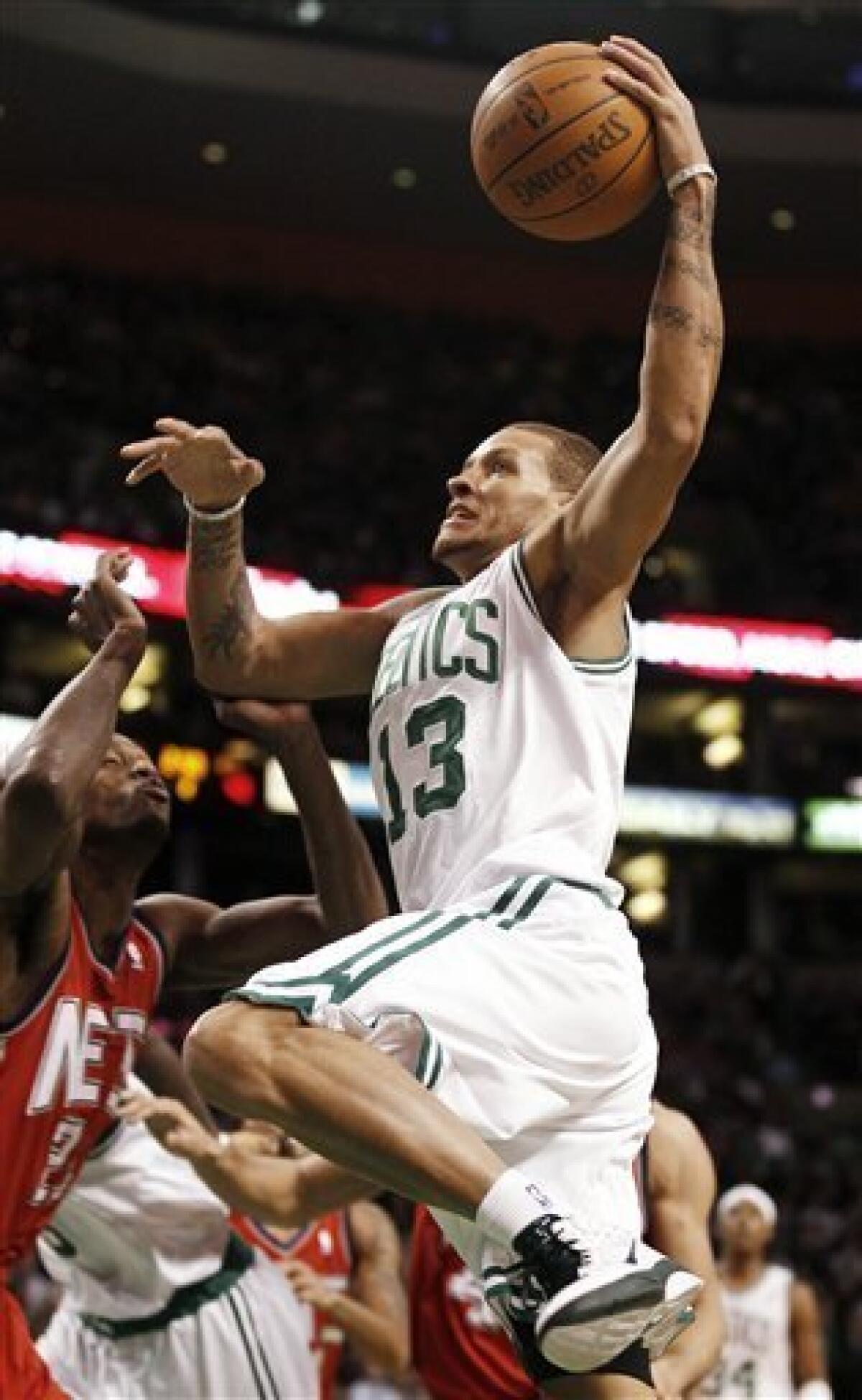 Celtics lose West, but Shaq leads them past Nets