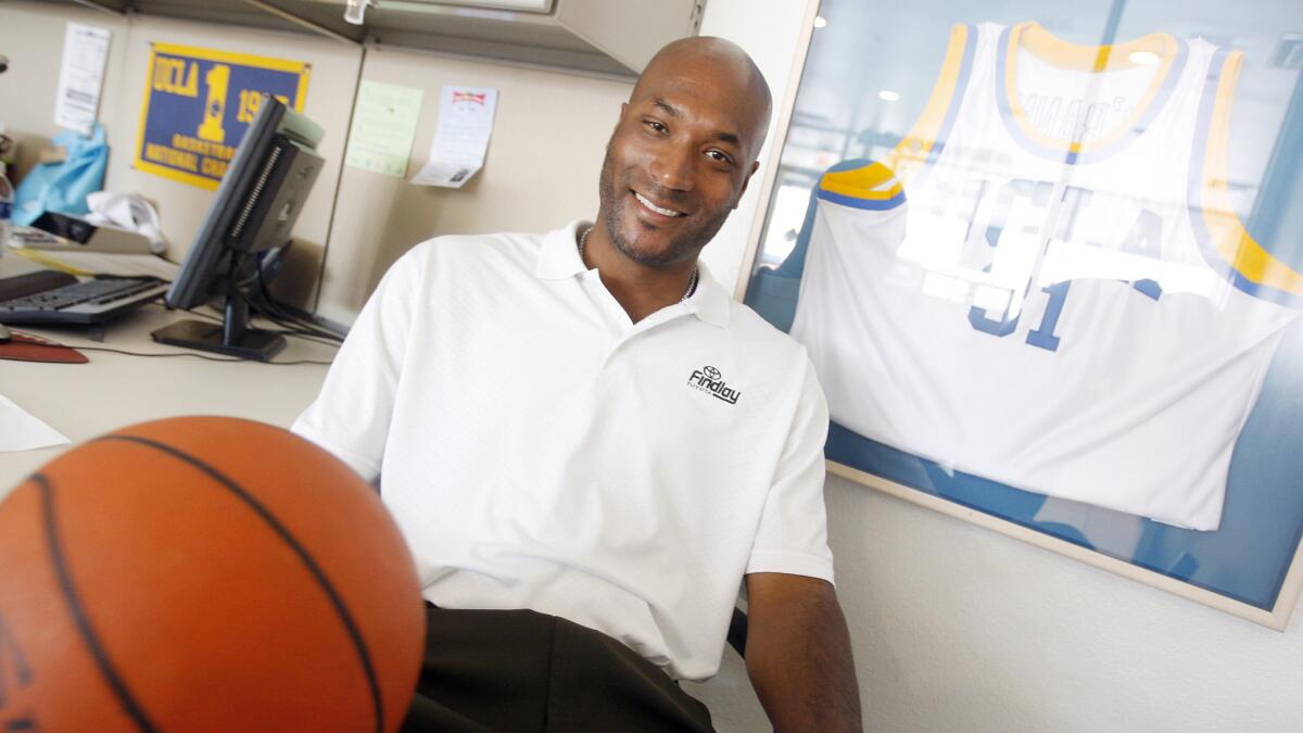 Former UCLA star Ed O'Bannon sits in his office in Henderson, Nev., in 2010. O'Bannon believes current and former college athletes should receive a share of the revenues generated by the NCAA.