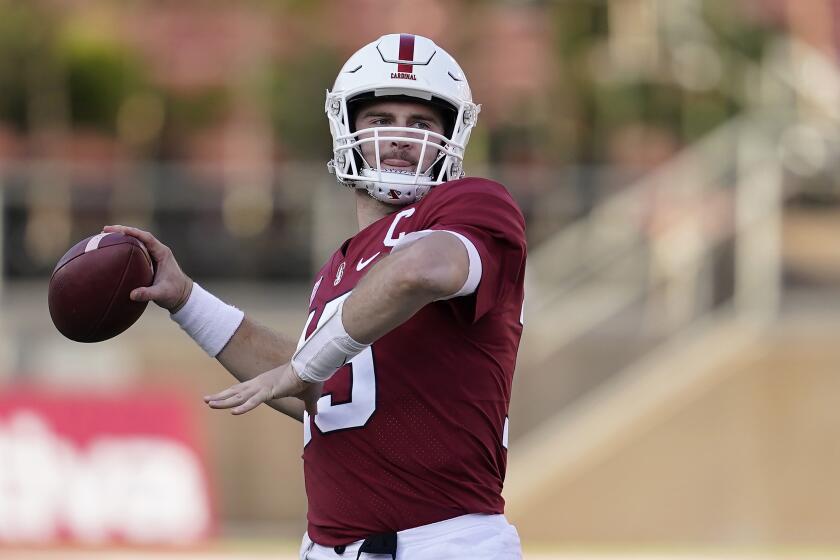 Stanford quarterback Davis Mills throws a warm up pass during the second half.