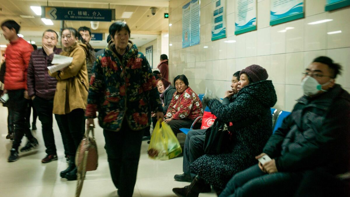 Patients wait in a hospital in Baoding, China, in December 2017.