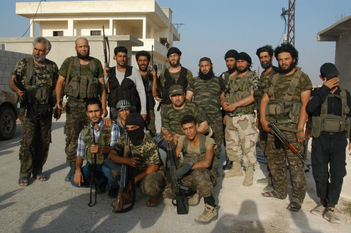 Members of the Free Syrian Army pose in Aleppo, Syria. Nominally deemed secular and moderate, the FSA's groups are trying to overthrow President Bashar Assad and fight Islamic State. If the U.S. does increase military support of Syrian rebels, these groups would be the recipients.
