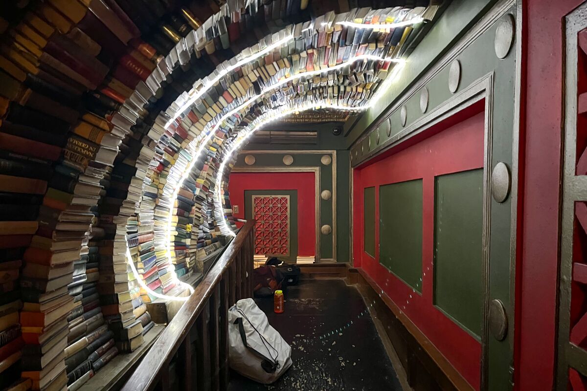 Packed bags in the tunnel at the Last Bookstore