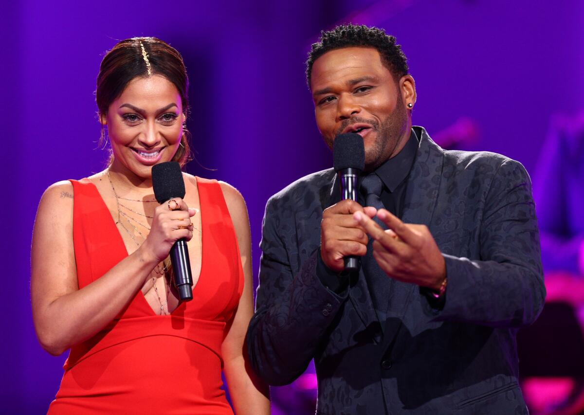 Hosts La La Anthony and Anthony Anderson speak onstage during the VH1 "Dear Mama" taping on May 6.