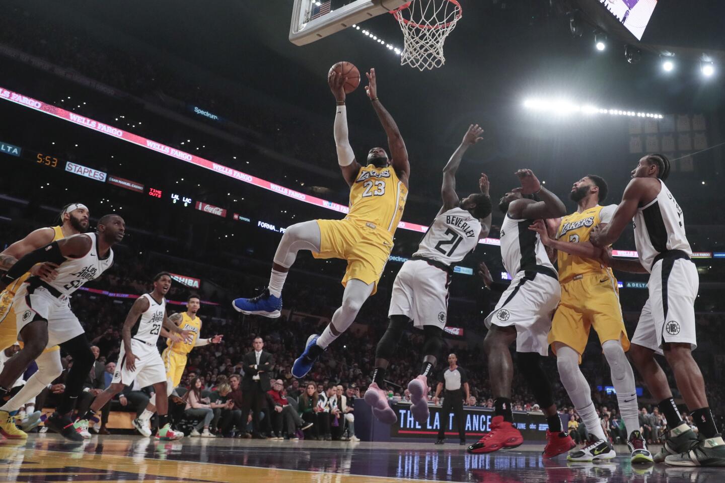 Lakers forward LeBron James drives to the basket for a layup against the Clippers in the first half.