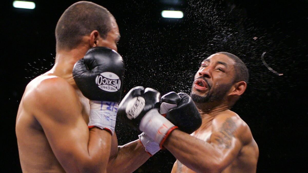 Jose Luis Castillo, left, lands a knockdown punch against Diego Corrales during their lightweight title bout in 2005.