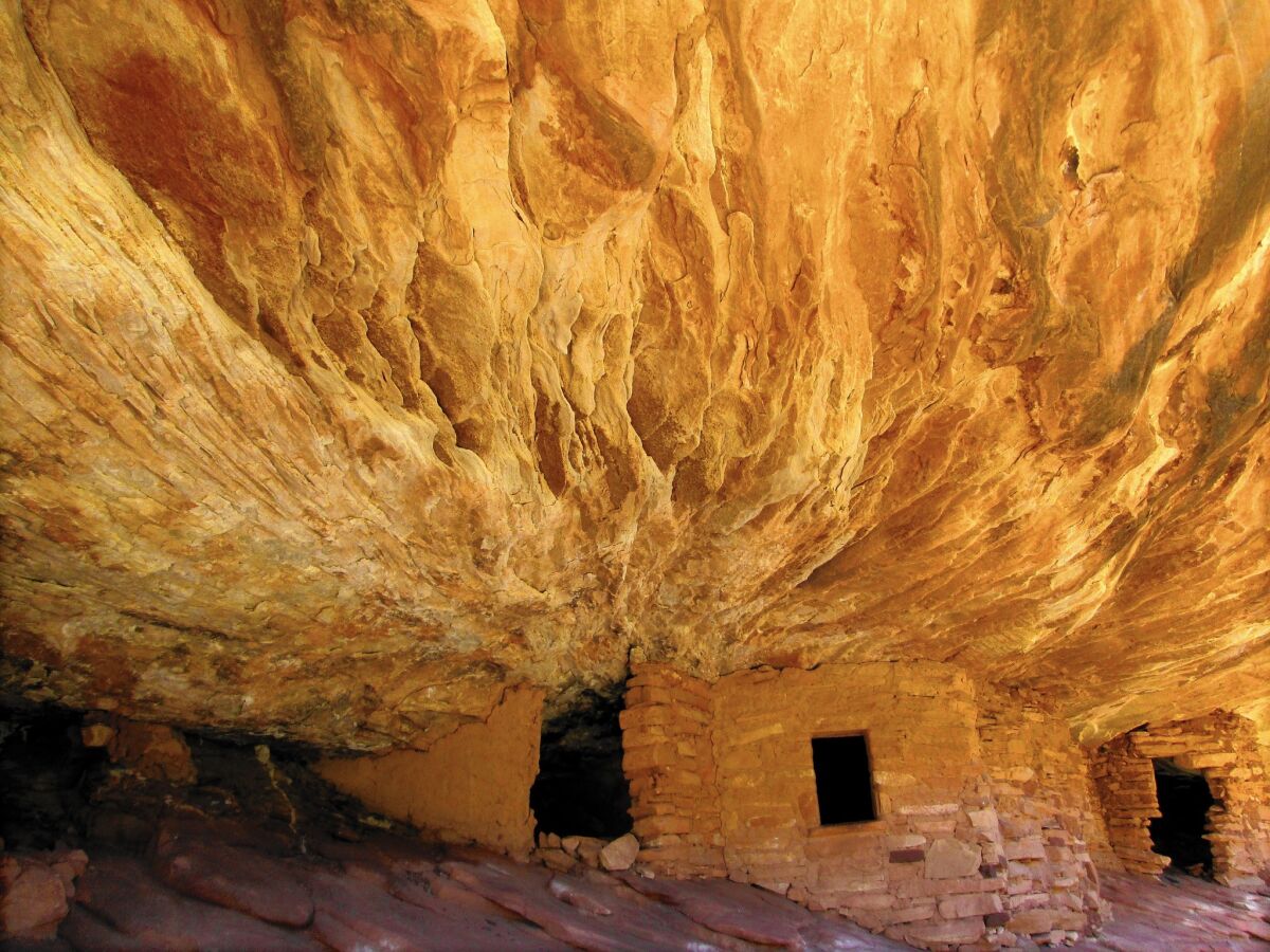 The 'House on Fire' ruin, located in Mule Canyon, Utah, is so named because sunlight causes a 'fiery' effect over the cliff dwellings.