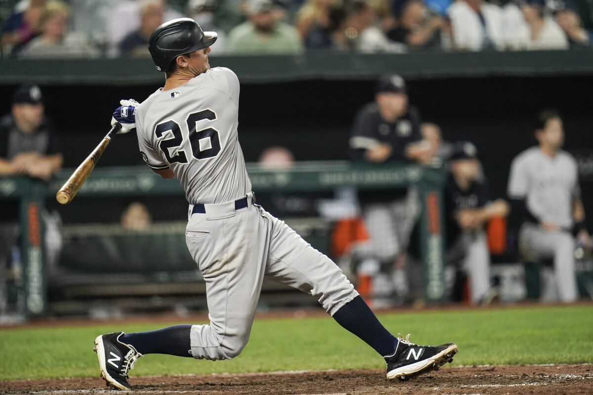 New York Yankees' DJ LeMahieu connects for a solo home run against the Baltimore Orioles during the ninth inning of a baseball game, Tuesday, Sept. 14, 2021, in Baltimore. (AP Photo/Julio Cortez)