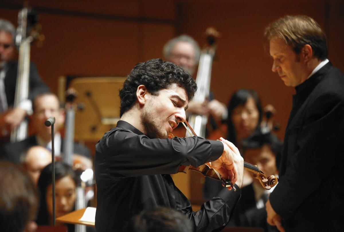 Violinist Sergey Khachatryan performs in the first half while conductor Ludovic Morlot performed for the whole concert at Walk Disney Concert Hall on Nov. 14, 2015.
