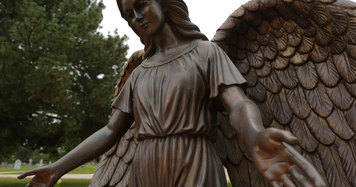 Photo: latimes.com A sculpture of an angel stands at a memorial for survivors and lives lost to suicide dedicated by the Archdiocese of Chicago