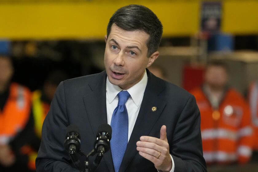 FILE - Transportation Secretary Pete Buttigieg speaks before the arrival of President Joe Biden at the construction site of the Hudson Tunnel Project, Tuesday, Jan. 31, 2023, in New York. Nearly 50 businesses and nonprofits including rideshare companies Uber and Lyft, industrial giant 3M and automaker Honda are pledging millions of dollars in initiatives to stem a "crisis" in road fatalities under a new federal effort announced Friday, Feb. 3. (AP Photo/John Minchillo)