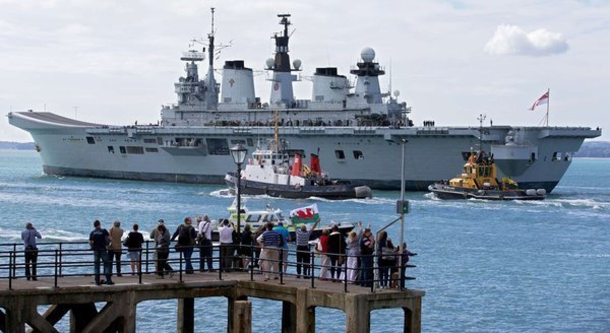 Britain's helicopter carrier Illustrious leaves Portsmouth navy base in southern England on Monday. British warships began setting sail for the Mediterranean for a naval exercise that will see one vessel dock in Gibraltar, amid tensions with Spain over the British-held territory.