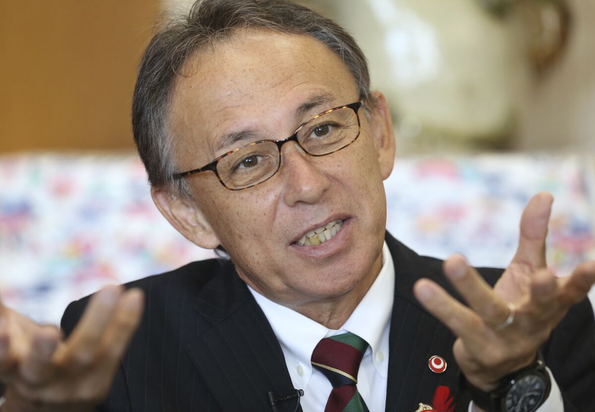 FILE - Okinawa Gov. Denny Tamaki speaks during an interview with The Associated Press in Tokyo on Oct. 31, 2018. Japan should do more for peaceful diplomacy with China and not just focus on arms deterrence as tensions rise around Taiwan to the west of Okinawa, said the southern island prefecture's governor Friday, May 6, 2022, demanding further reduction of its security burden and its risk hosting U.S. military there. (AP Photo/Koji Sasahara, File)