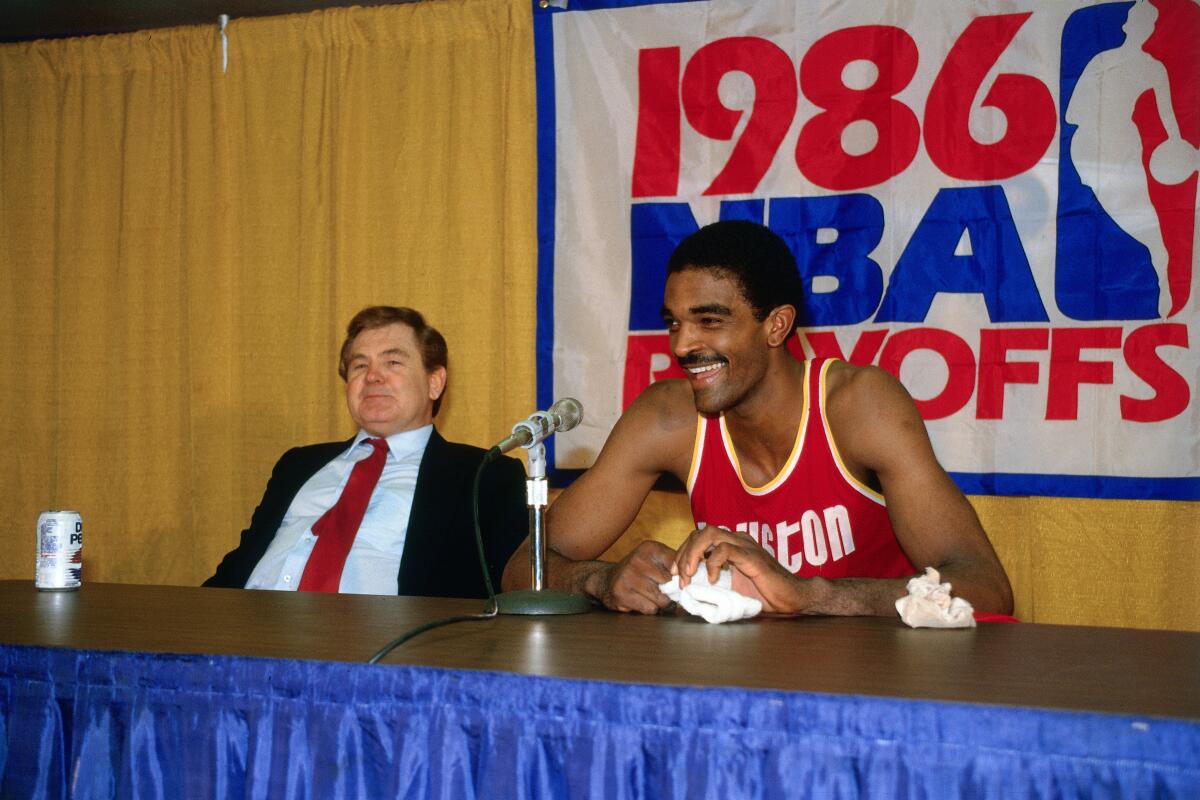 Houston Rocket Ralph Sampson and coach Bill Fitch talk during a 1986 NBA playoff series against the Lakers at the Forum.