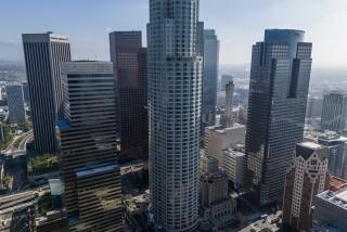 LOS ANGELES, CA- MARCH 28: The Gas Company Tower (right) in downtown, Los Angeles, CA, is facing foreclosure a year after the owner, an affiliate of Brookfield Asset Management Ltd., walked away from the building. A notice of trustee's sale for the building was filed March 21 with the Los Angeles County Recorder's office, setting the stage for a foreclosure sale as soon as 90 days after the filing. Photographed on Thursday, March 28, 2024. (Myung J. Chun / Los Angeles Times)