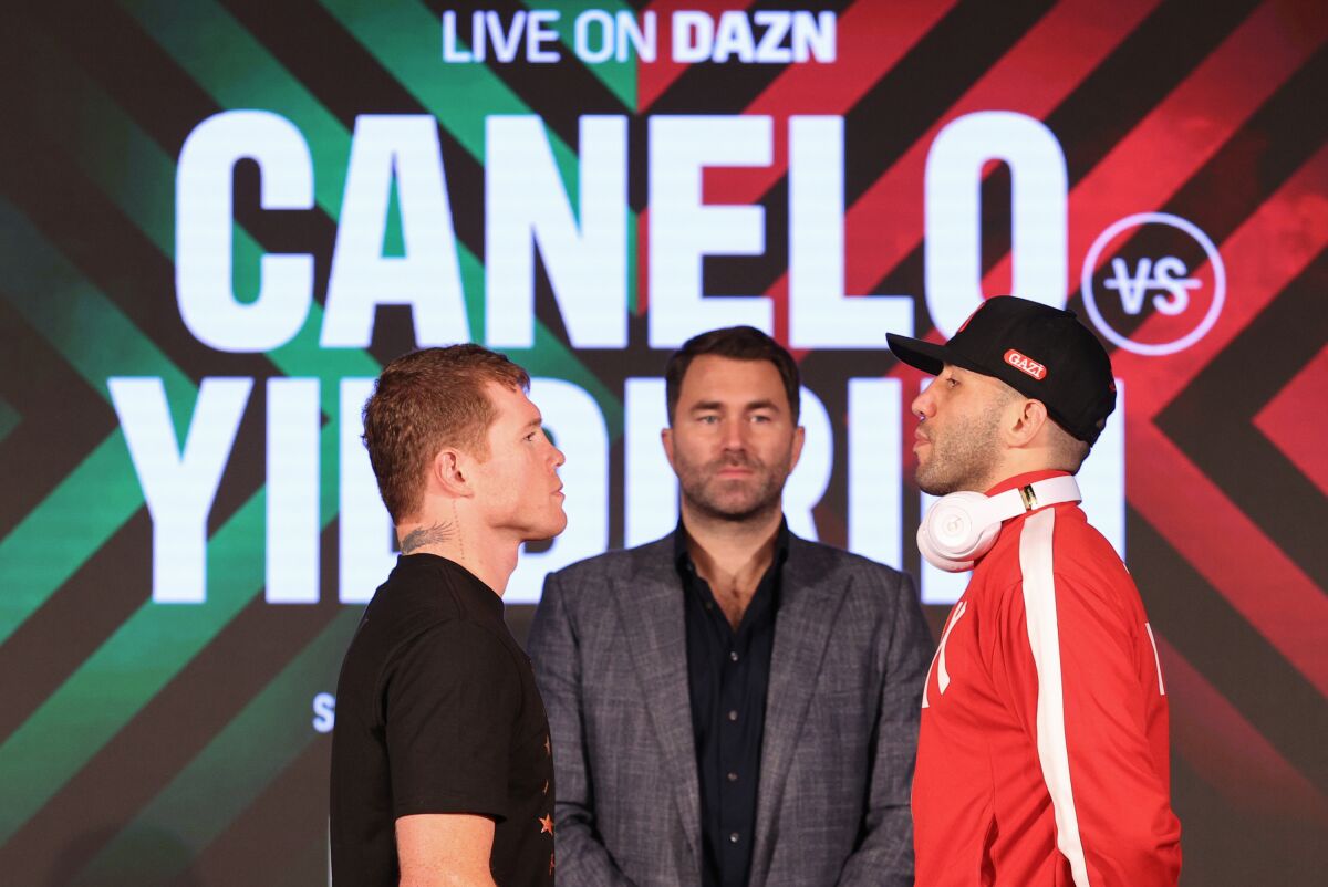Canelo Alvarez and Avni Yildirim face off during a news conference earlier this week.