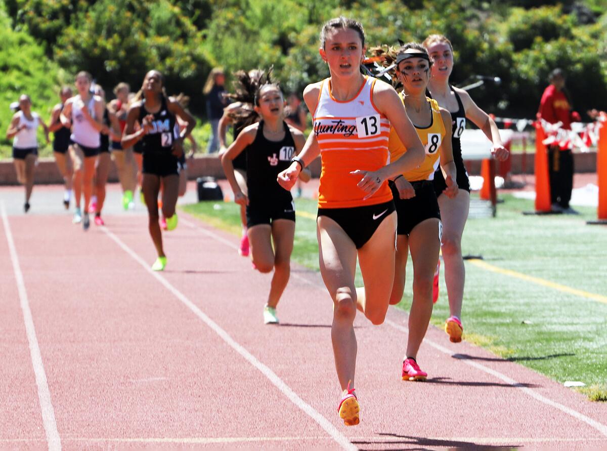 Huntington Beach's Makenzie McRae wins the seeded 1,600 meters of the Orange County track and field championships.