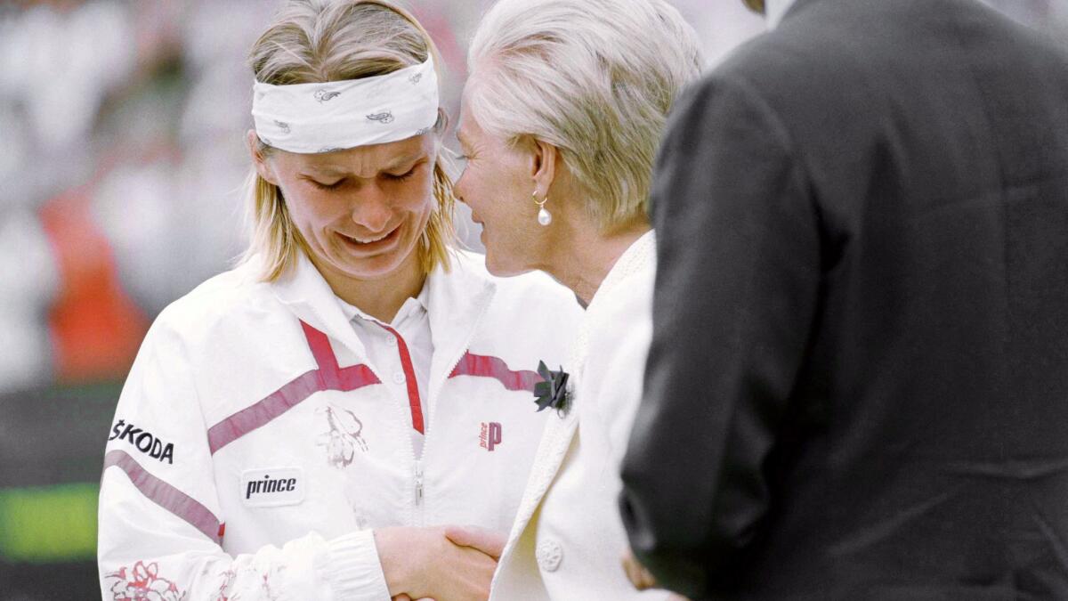 Jana Novotna breaks down and weeps, as she accepts the loser's plate from the Duchess of Kent on Centre Court at Wimbledon, London.
