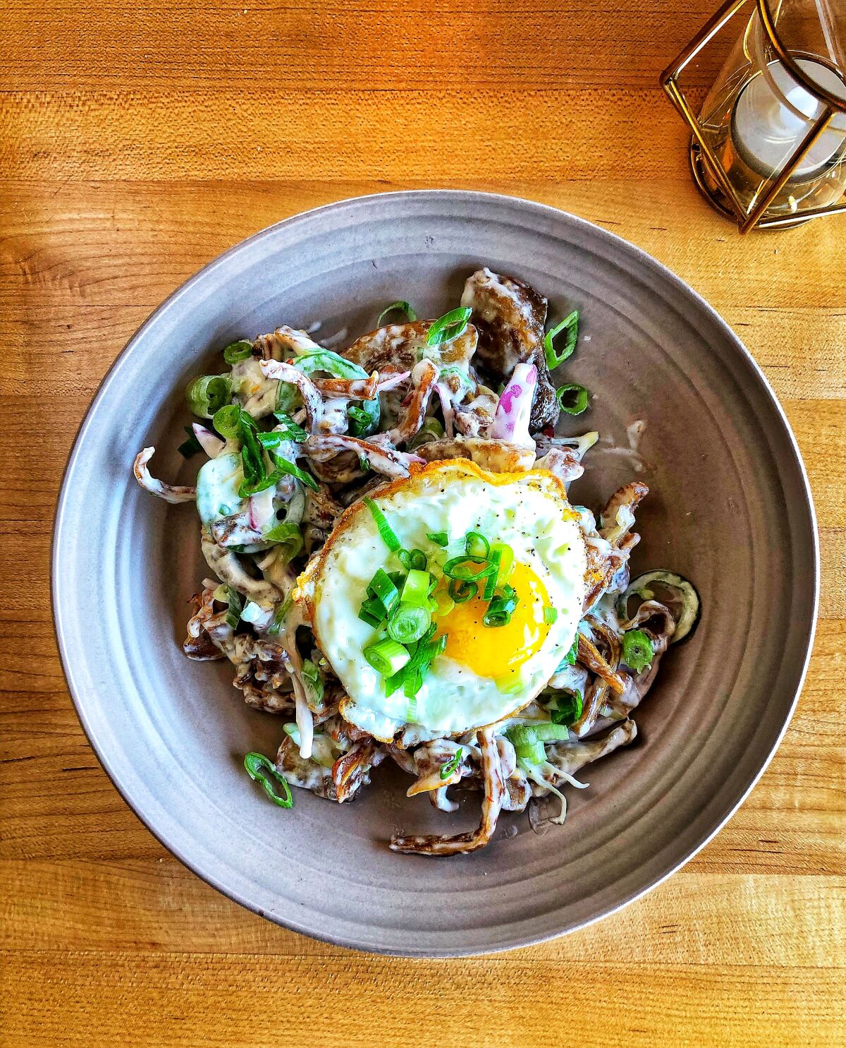 Chef Danino "DJ" Tangalin gives the traditional sisig a twist by making it with pig ears instead of minced pork.