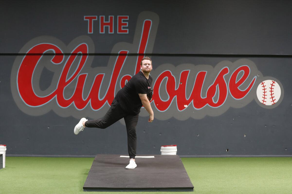 Newport Beach resident Brooks Pounders pitches at the Clubhouse in Costa Mesa.