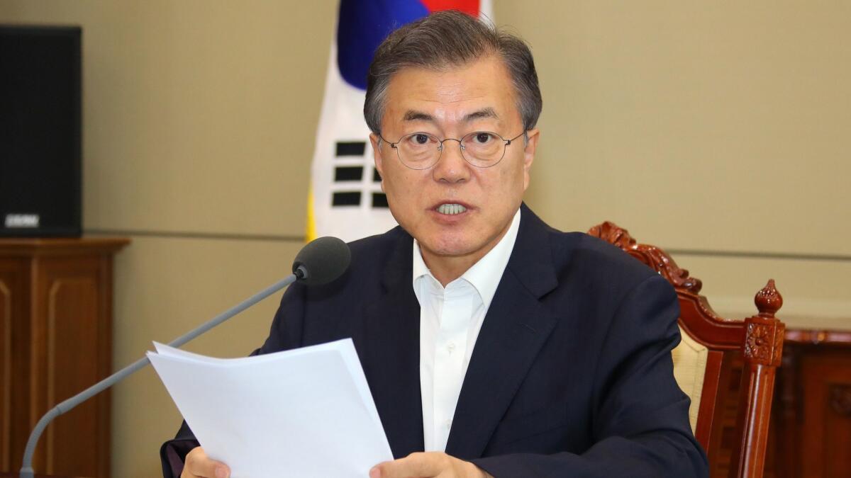 South Korean President Moon Jae-in talks during a meeting with his senior aides at the presidential Blue House in Seoul on May 14, 2018.