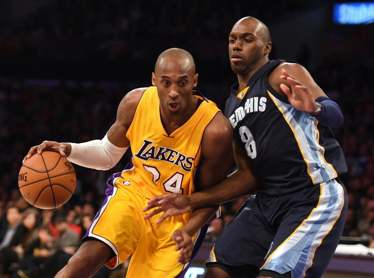 Kobe Bryant drives against Memphis' Quincy Pondexter during a the Lakers' 109-106 loss to the Grizzlies on Friday at Staples Center.